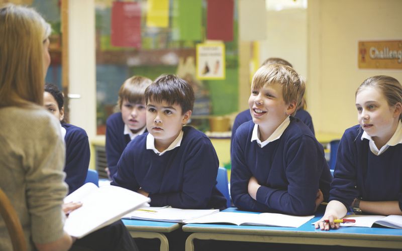 Teacher leading a group of students