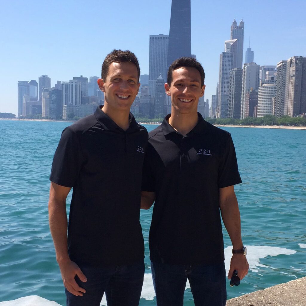 Joseph and Matthew pictured together with Chicago city scape behind them